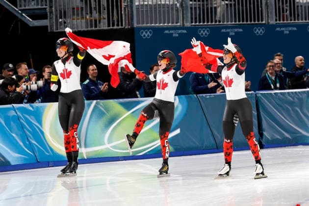 Isabelle Weidemann, Ivanie Blondin and Valerie Maltais of Team Canada skate around the track after winning gold during the Women s Speed skating, Eisschnelllauf Team Pursuit Finals at the Milano Speed Skating Stadium in Milan, Italy on Tuesday, February 17, 2026. Netherlands won silver and Japan won bronze.  OLY20260217958 AARONxJOSEFCZYK