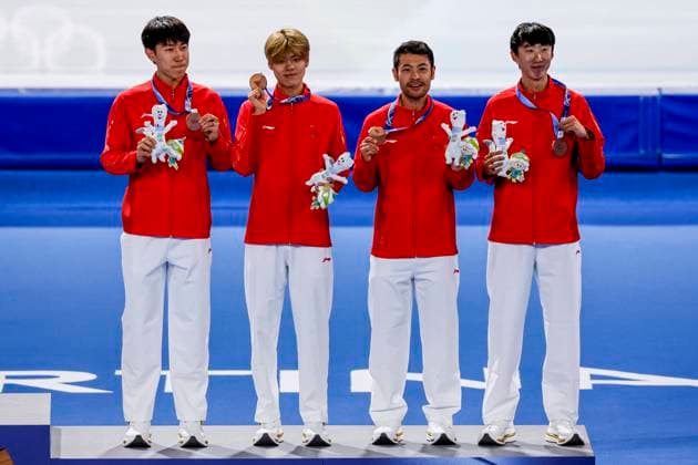third team of China, Hanbin Liu of China and Yu Wu of China and Wenhao Li of China and Zhongyan Ning of China smiling during the medal ceremony after Men s Team Pursuit Finals, Milano Cortina 2026 Winter Olympics: Day 11, Speed skating, Eisschnelllauf - Milano Cortina 2026 Winter Olympics: Day 11, Milano Speed Skating Stadium, February 17, 2026, Milan, Italy.