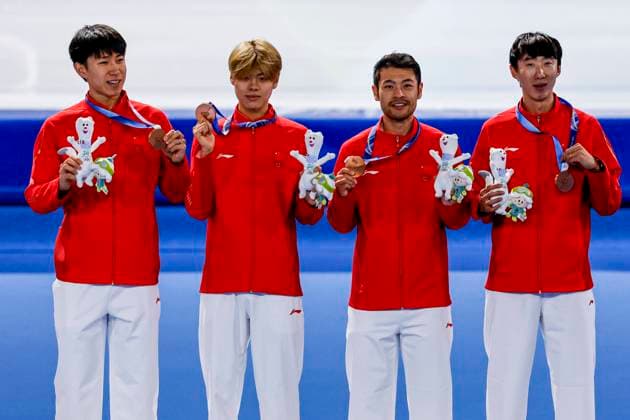 third team of China, Hanbin Liu of China and Yu Wu of China and Wenhao Li of China and Zhongyan Ning of China smiling during the medal ceremony after Men s Team Pursuit Finals, Milano Cortina 2026 Winter Olympics: Day 11, Speed skating, Eisschnelllauf - Milano Cortina 2026 Winter Olympics: Day 11, Milano Speed Skating Stadium, February 17, 2026, Milan, Italy.