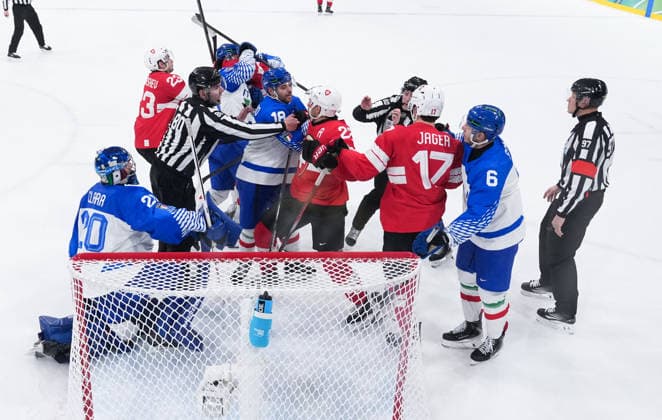 (260217) -- MILAN, Feb. 17, 2026 -- Players of Switzerland and Italy fight with each other during the Ice hockey, Eishockey men s qualification play-off match between Switzerland and Italy at the Milan-Cortina 2026 Olympic Winter games, Winterspiele,Spiele, Summer games in Milan, Italy, Feb. 17, 2026. ) (MICO2026)ITALY-MILAN-OLYMPIC WINTER GAMES-ICE HOCKEY-MEN-QUALIFICATION PLAY-OFF-SUI VS ITA TaoxXiyi 