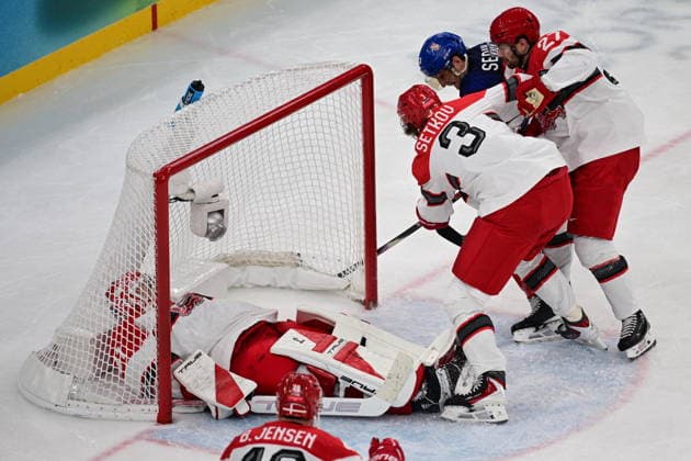 XXV Winter Olympic Games, Olympische Spiele, Olympia, OS in Milan, Italy, on February 17, 2026. Men s Ice hockey, Eishockey preliminary round playoffs, Czechia - Denmark. From left: Frederik Andersen of Denmark, Malte Setkov of Denmark, Lukas Sedlak of the Czech Republic, Oliver Bjorkstrand of Denmark. (CTKxPhoto MichalxKamaryt) CTKPhotoP2026021707408  CTKPhotoP2026021707408