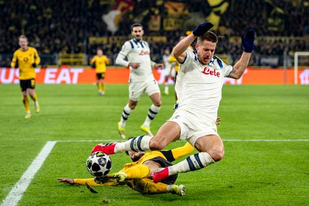 Atalanta midfielder Mario Pasalic, Borussia Dortmund defender Ramy Bensebaini, during the match Borussia Dortmund vs Atalanta BC at the BVB Stadion Dortmund for the Champions League - KO play-offs - 1st leg season 2025-2026 in DORTMUND, Germany on 17 february 2026. (Photo by Stefan Koops EYE4IMAGES DeFodi Images) -