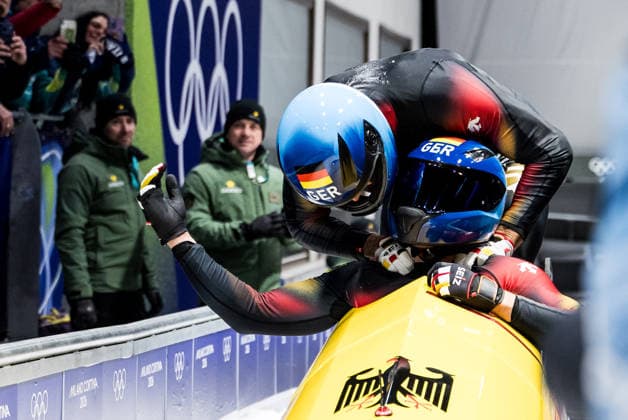 CORTINA, ITALY - FEBRUARY 17: Johannes Lochner and Georg Fleischhauer (Germany) cheer after winning Gold during the Bobsleigh 2-man at the Milano Cortina 2026 Olympics at Cortina Sliding Centre on day 11 of the Milano Cortina 2026 Olympics on February 17, 2026 in Cortina, Italy. Editorial use only. Italy Copyright: xSteffiexWunderlx