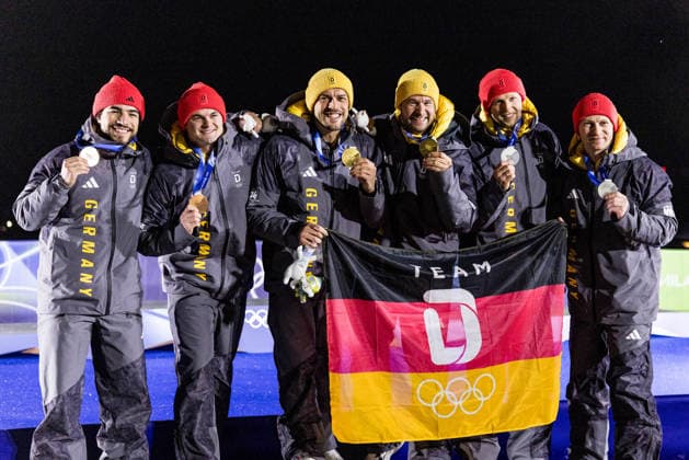 CORTINA, ITALY - FEBRUARY 17: The podium posing together - Bronze medalists Adam Ammour and Alexander Schaller (Germany), Gold medalists Johannes Lochner and Georg Fleischhauer (Germany), Silver medalists Francesco Friedrich and Alexander Schueller (Germany) - during the Bobsleigh 2-man medal ceremony at the Milano Cortina 2026 Olympics at Cortina Sliding Centre on day 11 of the Milano Cortina 2026 Olympics on February 17, 2026 in Cortina, Italy. Editorial use only. Italy Copyright: xSteffiexWunderlx