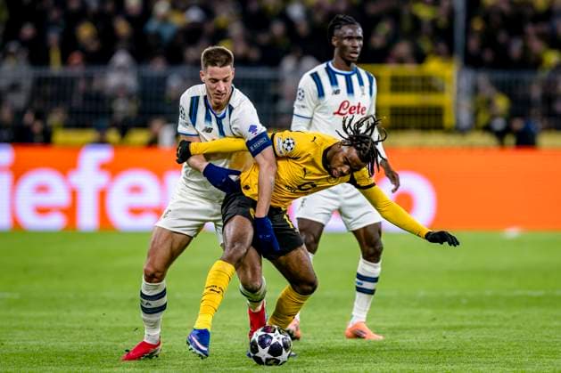 Atalanta midfielder Mario Pasalic, Borussia Dortmund midfielder Carney Chukwuemeka, during the match Borussia Dortmund vs Atalanta BC at the BVB Stadion Dortmund for the Champions League - KO play-offs - 1st leg season 2025-2026 in DORTMUND, Germany on 17 february 2026. (Photo by Stefan Koops EYE4IMAGES DeFodi Images) -