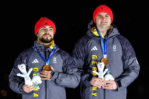 OLYMPICS - Winter Olympic Games, Olympische Spiele, Olympia, OS Milano Cortina 2026 CORTINA D AMPEZZO,ITALY,17.FEB.26 - OLYMPICS, BOBSLEIGH - Winter Olympic Games Milano Cortina 2026, 2-man, men, medal ceremony. Image shows Adam Ammour and Alexander Schaller (GER). Keywords: medal.  GEPAxpictures xMaticxKlansek