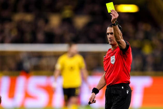DORTMUND, GERMANY - FEBRUARY 17: referee Serdar Gozubuyuk.shows a yellow card during the UEFA Champions League 2025 26 League Knockout Play-off First Leg match between Borussia Dortmund and Atalanta BC at BVB Stadion Dortmund on February 17, 2026 in Dortmund, Germany. (Photo by Rene Nijhuis) SPO  Copyright: xRenexNijhuis