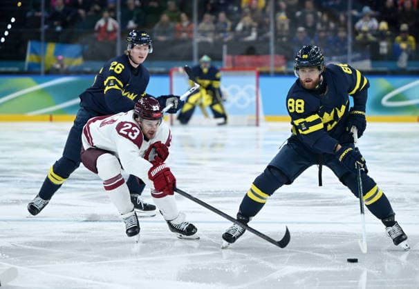 260217 -- MILAN, Feb. 17, 2026 -- William Nylander R of Sweden vies with Teodors Blugers of Latvia during the Ice hockey, Eishockey men s qualification play-off match between the Sweden and Latvia at the Milan-Cortina 2026 Olympic Winter games, Winterspiele,Spiele, Summer games in Milan, Italy, Feb. 17, 2026. MICO2026ITALY-MILAN-OLYMPIC WINTER GAMES-ICE HOCKEY-MEN-QUALIFICATION PLAY-OFF-SWE VS LAT ZhangxHaofu  (MICO2026)ITALY-MILAN-OLYMPIC WINTER GAMES-ICE HOCKEY-MEN-QUALIFICATION PLAY-OFF-SWE VS LAT IMAGO ZhangxHaofu  imago images 0847879250