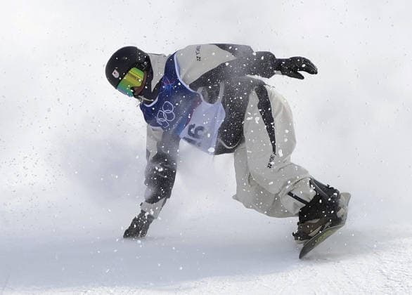 Milan Cortina Olympics: Snowboard Ryoma Kimata of Japan loses his balance on landing during the men s snowboard slopestyle final at the Milan Cortina Olympics on Feb. 18, 2026, at Livigno Snow Park in Livigno, Italy.  A14AA0005299988P
