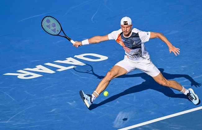 ATP, Tennis Herren QATAR EXXONMOBIL OPEN-ROUND OF Marton Fucsovics of Hungary competes against Karen Khachanov of Russia during their men s singles round of 16 match at the ATP Qatar Exxonmobil Open 2026 tennis tournament at the Khalifa International Tennis Complex in Doha, Qatar, on February 18, 2026. DOHA Qatar Copyright: xNOUSHADx