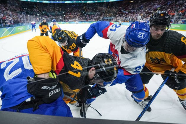 2026 Milano-Cortina Winter Olympics MILAN, ITALY - FEBRUARY 18: Adam Ruzicka (21) of Slovakia in action against Jonas Muller (41) of Germany during the quarterfinal Ice hockey, Eishockey match at the 2026 Milano-Cortina Winter Olympics at the Milano Santagiulia Ice Hockey Arena in Milan, Italy on February 18, 2026. Cemal Yurttas Anadolu Milan Italy. Editorial use only. Please get in touch for any other usage.  Copyright: x2026xAnadoluxCemalxYurttasx