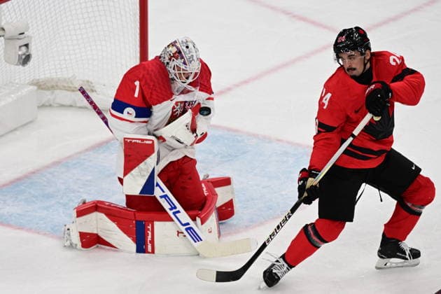 XXV Winter Olympic Games, Olympische Spiele, Olympia, OS in Milan, Italy, on February 18, 2026. Men s Ice hockey, Eishockey preliminary round playoffs, Czech Republic vs. Canada. From left Czech goalie Lukas Dostal, Seth Jarvis of Canada. (CTKxPhoto MichalxKamaryt) CTKPhotoP2026021807858  CTKPhotoP2026021807858