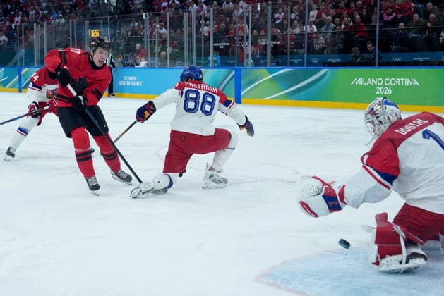 February 18, 2026, Milan, ITALY: Canada s Macklin Celebrini (17) scores goal against Czechia goalie Lukas Dostal (1) as Czechia s David Pastrnak (88) defends during the first period of a quarterfinal men s hockey game at the 2026 Winter Olympics, in Milan, on Wednesday, Feb. 18, 2026. Canada News - February 18, 2026  - ZUMAc35_ 20260218_zaf_c35_068 Copyright: xDarrylxDyckx