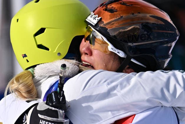 (260218) -- LIVIGNO, Feb. 18, 2026 -- Xu Mengtao (R) of China is congratulated after the freestyle skiing women s aerials final 2 at the Milan-Cortina 2026 Olympic Winter games, Winterspiele,Spiele, Summer games in Livigno, Italy, Feb. 18, 2026. ) (MICO2026)ITALY-LIVIGNO-OLYMPIC WINTER GAMES-FREESTYLE SKIING-WOMEN S AERIALS-FINAL ZhangxHongxiang 