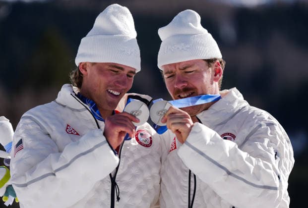 (260218) -- TESERO, Feb. 18, 2026 -- Silver medalists Ben Ogden and Gus Schumacher of the United States display their medals during the awarding ceremony for the cross-country skiing men s team sprint free at the Milan-Cortina 2026 Olympic Winter games, Winterspiele,Spiele, Summer games in Tesero, Italy, Feb. 18, 2026. ) (MICO2026)ITALY-TESERO-OLYMPIC WINTER GAMES-CROSS-COUNTRY SKIING-MEN S TEAM SPRINT FREE PengxZiyang 