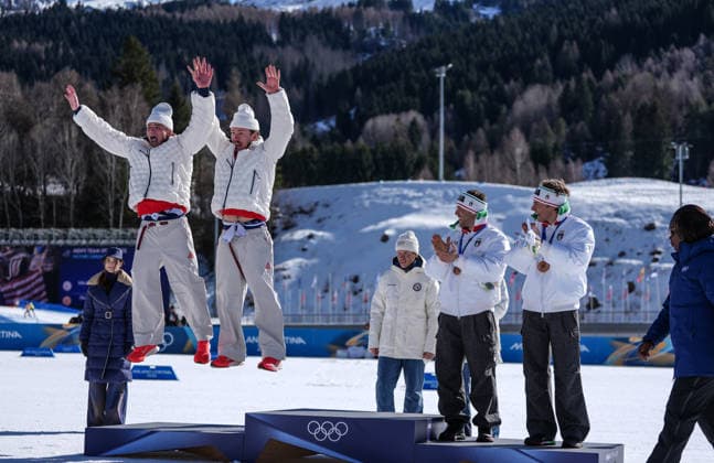 (260218) -- TESERO, Feb. 18, 2026 -- Silver medalists Ben Ogden and Gus Schumacher of the United States react during the awarding ceremony for the cross-country skiing men s team sprint free at the Milan-Cortina 2026 Olympic Winter games, Winterspiele,Spiele, Summer games in Tesero, Italy, Feb. 18, 2026. ) (MICO2026)ITALY-TESERO-OLYMPIC WINTER GAMES-CROSS-COUNTRY SKIING-MEN S TEAM SPRINT FREE PengxZiyang 