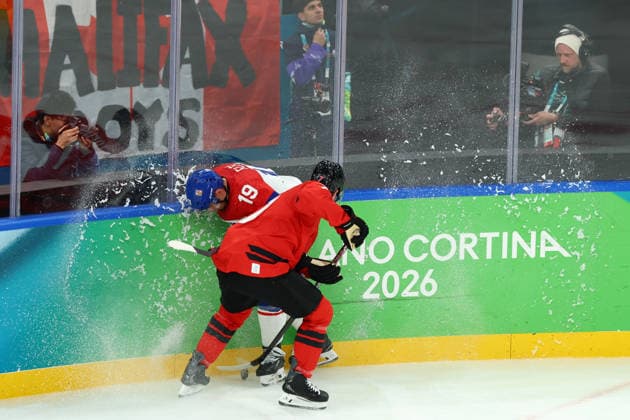 February 18, 2026, Milan, Lombardy, Italy: DEVON TOEWS 7 of Canada and JAKUB FLEK 19 of Czechia fight for the puck during the Quarterfinal game between Team Canada (CAN) and Team Czechia (CZE) at the Milano Cortina 2026 Olympic Games, Olympische Spiele, Olympia, OS Olympics 2026: Milano Cortina: Ice hockey, Eishockey Men: CAN:CZE  - ZUMAc179 20260218_oly_c179_044 Copyright: xMickaelxChavetx