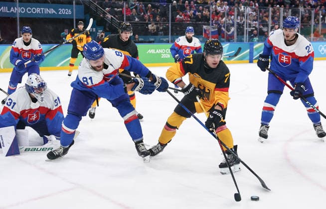 (260218) -- MILAN, Feb. 18, 2026 -- John Peterka (R, front) of Germany vies with Erik Cernak (L,front) of Slovakia during the Ice hockey, Eishockey men s play-offs quarterfinal between the Slovakia and Germany at the Milan-Cortina 2026 Olympic Winter games, Winterspiele,Spiele, Summer games in Milan, Italy, Feb. 18, 2026. ) (MICO2026)ITALY-MILAN-OLYMPIC WINTER GAMES-ICE HOCKEY-MEN-PLAY-OFFS QUARTERFINALS-SVK VS GER WangxKaiyan 