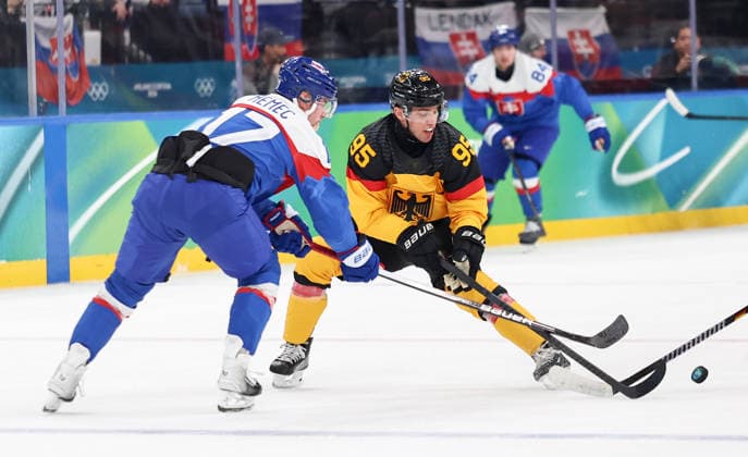 (260218) -- MILAN, Feb. 18, 2026 -- Frederik Tiffels (R) of Germany vies with Simon Nemec of Slovakia during the Ice hockey, Eishockey men s play-offs quarterfinal between the Slovakia and Germany at the Milan-Cortina 2026 Olympic Winter games, Winterspiele,Spiele, Summer games in Milan, Italy, Feb. 18, 2026. ) (MICO2026)ITALY-MILAN-OLYMPIC WINTER GAMES-ICE HOCKEY-MEN-PLAY-OFFS QUARTERFINALS-SVK VS GER WangxKaiyan 