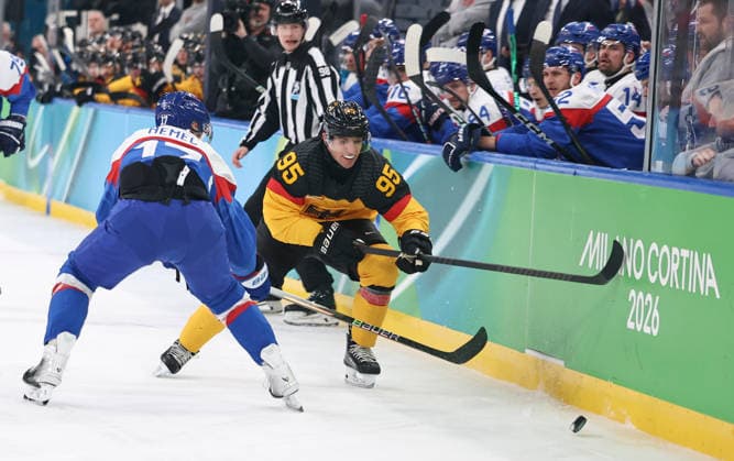 (260218) -- MILAN, Feb. 18, 2026 -- Frederik Tiffels (R) of Germany vies with Simon Nemec of Slovakia during the Ice hockey, Eishockey men s play-offs quarterfinal between the Slovakia and Germany at the Milan-Cortina 2026 Olympic Winter games, Winterspiele,Spiele, Summer games in Milan, Italy, Feb. 18, 2026. ) (MICO2026)ITALY-MILAN-OLYMPIC WINTER GAMES-ICE HOCKEY-MEN-PLAY-OFFS QUARTERFINALS-SVK VS GER WangxKaiyan 