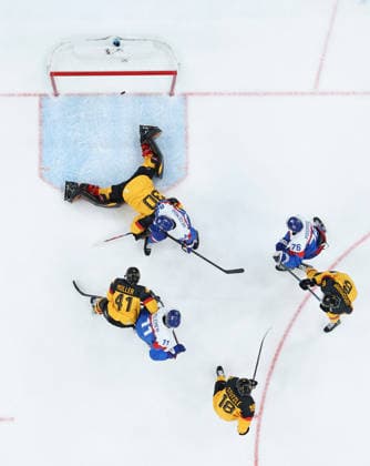 (260218) -- MILAN, Feb. 18, 2026 -- Goalkeeper Philipp Grubauer (Top) of Germany fails to save the puck during the Ice hockey, Eishockey men s play-offs quarterfinal between the Slovakia and Germany at the Milan-Cortina 2026 Olympic Winter games, Winterspiele,Spiele, Summer games in Milan, Italy, Feb. 18, 2026. ) (MICO2026)ITALY-MILAN-OLYMPIC WINTER GAMES-ICE HOCKEY-MEN-PLAY-OFFS QUARTERFINALS-SVK VS GER WangxKaiyan 