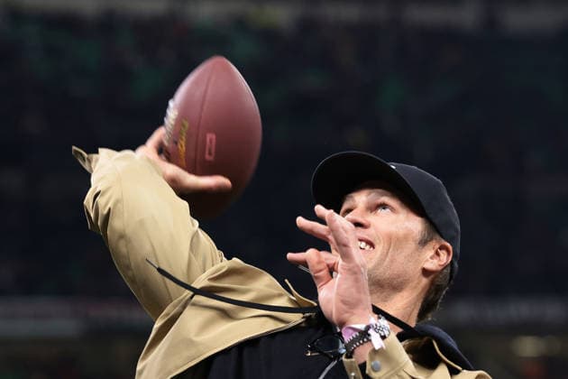 Milan, Italy, 18th February 2026. Former NFL, American Football Herren, USA American football quarterback Tom Brady throws a ball to fans prior to the AC Milan vs Como 1907 Serie A match at Giuseppe Meazza, Milan. Picture credit should read: Jonathan Moscrop Sportimage EDITORIAL USE ONLY. No use with unauthorised audio, video, data, fixture lists, club league logos or live services. Online in-match use limited to 120 images, no video emulation. No use in betting, games or single club league player publications. SPI_006_MILAN_COMO_ SPI-4548-0006
