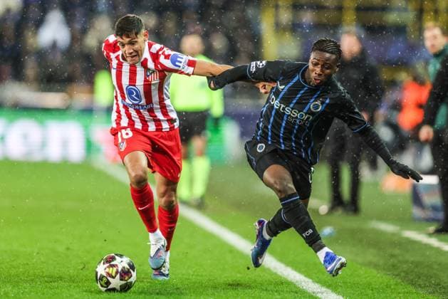 Atletico Madrid s Nahuel Molina and Club s Mamadou Diakhon fight for the ball during a soccer game between Belgian Club Brugge KV and Spanish Atletico de Madrid, in Brugge on Wednesday 18 February 2026, the first leg of the play-offs for the knockout phase of the UEFA Champions League tournament. BRUNOxFAHY  x164157920x