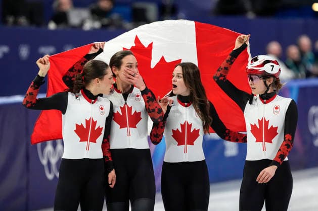 Members to Team Canada skate around the track after winning bronze during during the Women s Short Track Speed skating, Eisschnelllauf 3000m Relay Finals at the Milano Figure skating, Eiskunstlauf Arena in Milan, Italy on Wednesday, February 18, 2026. Korea won gold and Canada won bronze.  OLY20260218119 RICHARDxELLIS
