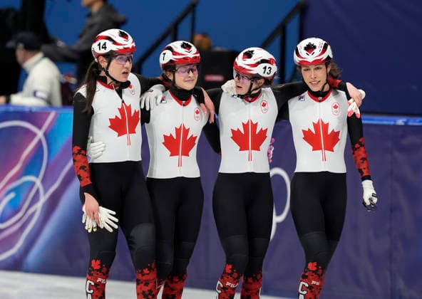 Courtney Sarault, 14, Danae Blais, 7, Kim Boutin, 13, and Florence Brunelle, 8, of Team Canada skate together after winning bronze during the Women s Short Track Speed skating, Eisschnelllauf 3000m Relay Finals at the Milano Figure skating, Eiskunstlauf Arena in Milan, Italy on Wednesday, February 18, 2026. Korea won gold and Italy won silver.  OLY20260218116 RICHARDxELLIS