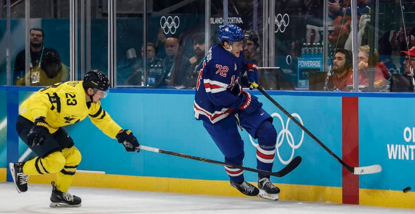 United States Tage Thompson (72) takes the puck from Sweden s Lucas Raymond (23) in the first period of the Men s Hockey Playoff Quarter-final game between Sweden and the USA at the Milano Santagiulia Ice hockey, Eishockey Arena in Milan, Italy, on Wednesday, February 18, 2026.  OLY20260218314 AARONxJOSEFCZYK