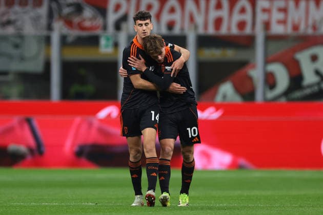 Milan, Italy, 18th February 2026. Nico Paz of Como 1907 celebrates with team mate Jacobo Ramon after scoring to give the visitors a 1-0 lead during the AC Milan vs Como 1907 Serie A match at Giuseppe Meazza, Milan. Picture credit should read: Jonathan Moscrop Sportimage EDITORIAL USE ONLY. No use with unauthorised audio, video, data, fixture lists, club league logos or live services. Online in-match use limited to 120 images, no video emulation. No use in betting, games or single club league player publications. SPI_031_MILAN_COMO_ SPI-4548-0031