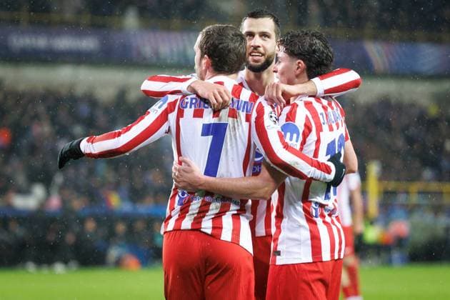 Atletico players celebrate after scoring during a soccer game between Belgian Club Brugge KV and Spanish Atletico de Madrid, in Brugge on Wednesday 18 February 2026, the first leg of the play-offs for the knockout phase of the UEFA Champions League tournament. KURTxDESPLENTER  x164162414x