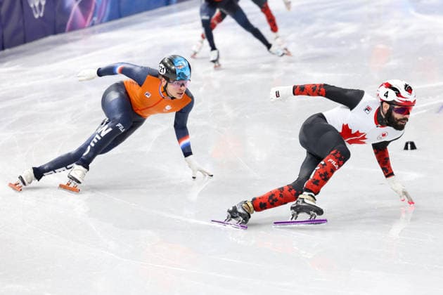 Winter Olympics - Steven Dubois Wins Gold At Speed skating, Eisschnelllauf Men s 500m Steven Dubois of Team Canada and Melle van T Wout of Team Netherlands compete during the Short Track Speed Skating Men s 500m on day twelve of the Milano Cortina 2026 Winter Olympic Games, Olympische Spiele, Olympia, OS at Milano Ice Skating Arena on February 18, 2026 in Milan, Italy. Photo by Alexis Jumeau ABACAPRESS.COM Milan Italy  Copyright: xJumeauxAlexis ABACAx