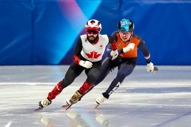 Steven Dubois, 4, of Canada and Melle van t Wout, 121, of Netherlands race around the track during the Men s Short Track Speed skating, Eisschnelllauf 500m Finals at the Milano Figure skating, Eiskunstlauf Arena in Milan, Italy on Wednesday, February 18, 2026. Dubois won gold, Melle van t Wout won silver and his brother, Jens van t Wout won bronze.  OLY20260218133 RICHARDxELLIS