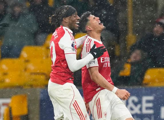 Wolverhampton, England, 18th February 2026. Piero Hincapie of Arsenal (r) celebrates scoring their second goal during the Wolverhampton Wanderers vs Arsenal Premier League match at Molineux, Wolverhampton. Picture: Andrew Yates Sportimage EDITORIAL USE ONLY. No use with unauthorised audio, video, data, fixture lists, club league logos or live services. Online in-match use limited to 120 images, no video emulation. No use in betting, games or single club league player publications. SPI_050_AY_Wolves_Arsenal SPI-4539-0052