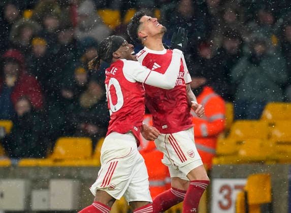 Wolverhampton, England, 18th February 2026. Piero Hincapie of Arsenal (r) celebrates scoring their second goal during the Wolverhampton Wanderers vs Arsenal Premier League match at Molineux, Wolverhampton. Pictu EDITORIAL USE ONLY. No use with unauthorised audio, video, data, fixture lists, club league logos or live services. Online in-match use limited to 120 images, no video emulation. No use in betting, games or single club league player publications. SPI_051_AY_Wolves_Arsenal SPI-4539-0053