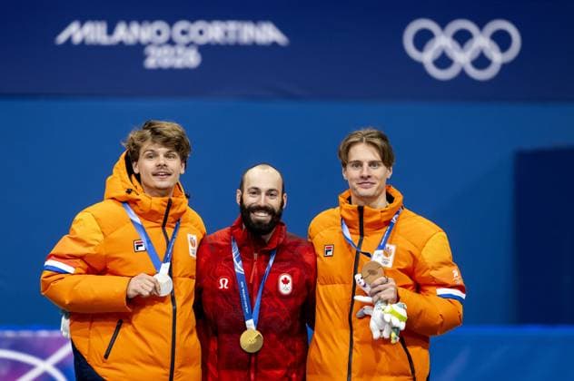 MILAN Melle van t Wout, Steven Dubois of Canada, and Jens van t Wout during the medal ceremony for the 500-meter short track Speed skating, Eisschnelllauf at the Milan Ice Skating Area at the Milan Winter Olympics. SEM VAN DER WAL ANP xVIxANPxSportx xxANPxIVx 551125866 originalFilename: 551125866.jpg