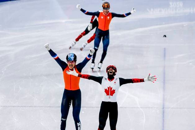 winner Steven Dubois of Canada and second Melle van t Wout of the Netherlands and third Jens van t Wout of the Netherlands celebrates after Men s 500m Finals, Milano Cortina 2026 Winter Olympics: Day 12, Short Track Speed skating, Eisschnelllauf - Milano Cortina 2026 Winter Olympics: Day 12, Milano Speed Skating Stadium, February 18, 2026, Milan, Italy.