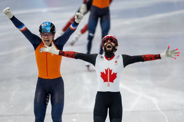 February 18, 2026, Milano, Lombardy, Italy: Steven Dubois (4) of Canada celebrate winning the gold medal and Melle van t Wout (121) of the Netherlands the silver medal in the Short Track Speed skating, Eisschnelllauf Men 500m Final during the 2026 Winter Olympics at the Milano Ice Skating Arena on Wednesday in Milano. Milano Italy - ZUMAj89_ 20260218_oly_j89_006 Copyright: xPaulxKitagakixJr.x