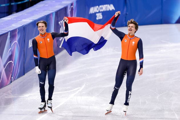 2026-02-18 Short Track Speed skating, Eisschnelllauf - Milano Cortina 2026 Winter Olympics - Day 12 MILAN, ITALY - FEBRUARY 18: Jens van t Wout of the Netherlands, Melle van t Wout of the Netherlands celebrating with flag after competing in the Men s 500m during Day 12 of Short Track Speed Skating - Milano Cortina 2026 Winter Olympics at Milano Ice Skating Arena on February 18, 2026 in Milan, Italy. (Photo by Joris Verwijst BSR Agency) Milan Italy Content not available for redistribution in The Netherlands directly or indirectly through any third parties. Copyright: xBSRxAgencyx