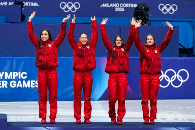 Bronze medalists Courtney Sarault, Florence Brunelle, Kim Boutin and Danae Blais of Team Canada step onto the podium during medal ceremony after the Women s Short Track Speed skating, Eisschnelllauf 3000m Relay Finals at the Milano Figure skating, Eiskunstlauf Arena in Milan, Italy on Wednesday, February 18, 2026. Korea won gold, Italy won silver and Canada won bronze.  OLY20260218140 RICHARDxELLIS
