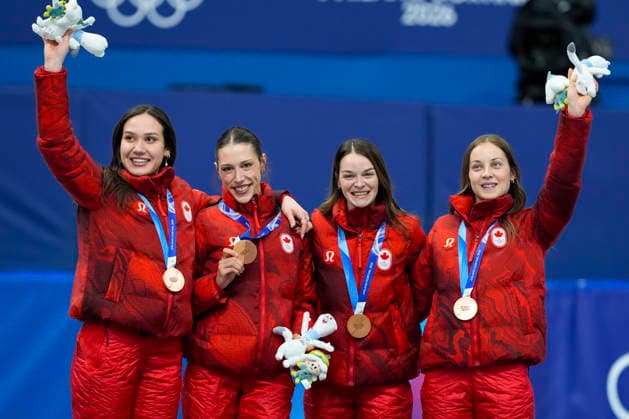 Bronze medalists Courtney Sarault, Florence Brunelle, Kim Boutin and Danae Blais of Team Canada smile during medal ceremony after the Women s Short Track Speed skating, Eisschnelllauf 3000m Relay Finals at the Milano Figure skating, Eiskunstlauf Arena in Milan, Italy on Wednesday, February 18, 2026. Korea won gold, Italy won silver and Canada won bronze.  OLY20260218148 RICHARDxELLIS