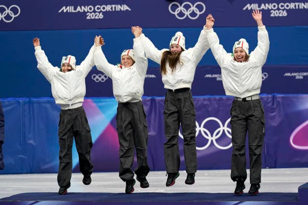 Silver medalists Arianna Sighel, Arianna Fontana, Elisa Confortola, and Chiara Betti of Team Italy jump onto the podium during the medal ceremony after the Women s Short Track Speed skating, Eisschnelllauf 3000m Relay Finals at the Milano Figure skating, Eiskunstlauf Arena in Milan, Italy on Wednesday, February 18, 2026. Korea won gold and Canada won bronze.  OLY20260218141 RICHARDxELLIS