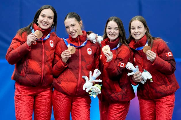 Bronze medalists Courtney Sarault, Florence Brunelle, Kim Boutin and Danae Blais of Team Canada smile during medal ceremony after the Women s Short Track Speed skating, Eisschnelllauf 3000m Relay Finals at the Milano Figure skating, Eiskunstlauf Arena in Milan, Italy on Wednesday, February 18, 2026. Korea won gold, Italy won silver and Canada won bronze.  OLY20260218149 RICHARDxELLIS