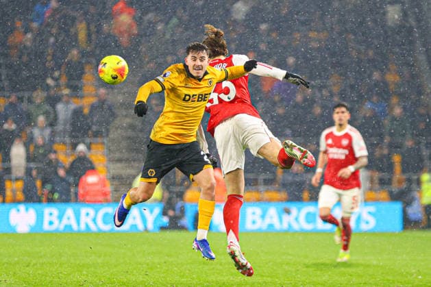 Rodrigo Gomes (21 Wolves) and Riccardo Calafiori (33 Arsenal) jump for the ball during the Premier League football match between Wolverhampton Wanderers and Arsenal at Molineux stadium in Wolverhampton, England Copyright: xNataliexMincher SPPx Sportspressphoto_SPR94672