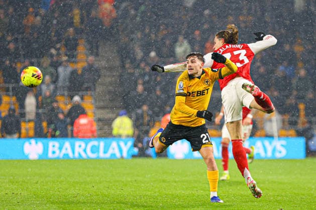 Rodrigo Gomes (21 Wolves) and Riccardo Calafiori (33 Arsenal) jump for the ball during the Premier League football match between Wolverhampton Wanderers and Arsenal at Molineux stadium in Wolverhampton, England Copyright: xNataliexMincher SPPx Sportspressphoto_SPR94673
