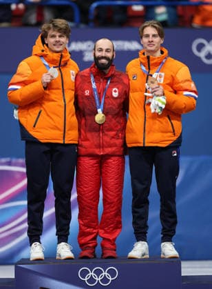 260218 -- MILAN, Feb. 18, 2026 -- Gold medalist Steven Dubois C of Canada, silver medalist Melle van t Wout L of the Netherlands, and bronze medalist Jens van t Wout of the Netherlands pose for photos during the awarding ceremony of the short track Speed skating, Eisschnelllauf men s 500m at the Milan-Cortina 2026 Olympic Winter games, Winterspiele,Spiele, Summer games in Milan, Italy, Feb. 18, 2026. MICO2026ITALY-MILAN-OLYMPIC WINTER GAMES-SHORT TRACK SPEED SKATING-MEN S 500M-FINALS LixMing  (MICO2026)ITALY-MILAN-OLYMPIC WINTER GAMES-SHORT TRACK SPEED SKATING-MEN S 500M-FINALS IMAGO LixMing  imago images 0847990017