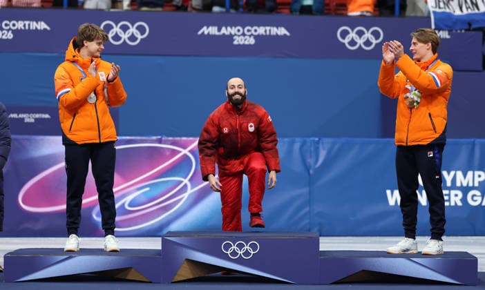 260218 -- MILAN, Feb. 18, 2026 -- Gold medalist Steven Dubois C of Canada, silver medalist Melle van t Wout L of the Netherlands, and bronze medalist Jens van t Wout of the Netherlands attend the awarding ceremony of the short track Speed skating, Eisschnelllauf men s 500m at the Milan-Cortina 2026 Olympic Winter games, Winterspiele,Spiele, Summer games in Milan, Italy, Feb. 18, 2026. MICO2026ITALY-MILAN-OLYMPIC WINTER GAMES-SHORT TRACK SPEED SKATING-MEN S 500M-FINALS LixMing  (MICO2026)ITALY-MILAN-OLYMPIC WINTER GAMES-SHORT TRACK SPEED SKATING-MEN S 500M-FINALS IMAGO LixMing  imago images 0847990058