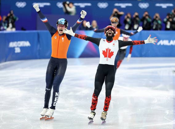 260218 -- MILAN, Feb. 18, 2026 -- Steven Dubois front of Canada celebrates after the short track Speed skating, Eisschnelllauf men s 500m final A at the Milan-Cortina 2026 Olympic Winter games, Winterspiele,Spiele, Summer games in Milan, Italy, Feb. 18, 2026. MICO2026ITALY-MILAN-OLYMPIC WINTER GAMES-SHORT TRACK SPEED SKATING-MEN S 500M-FINALS LixMing  (MICO2026)ITALY-MILAN-OLYMPIC WINTER GAMES-SHORT TRACK SPEED SKATING-MEN S 500M-FINALS IMAGO LixMing  imago images 0847990092