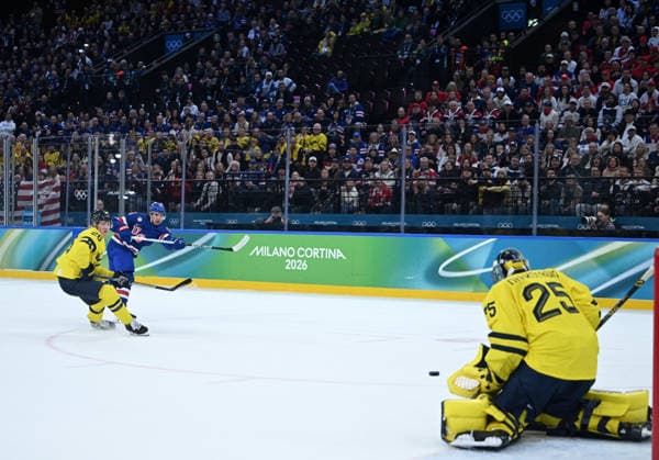 (260219) -- MILAN, Feb. 19, 2026 -- Jack Hughes (2nd L) of the United States takes a shot on goal during the Ice hockey, Eishockey men s play-offs quarterfinal between Sweden and the United States at the Milan-Cortina 2026 Olympic Winter games, Winterspiele,Spiele, Summer games in Milan, Italy, Feb. 18, 2026. ) (MICO2026)ITALY-MILAN-OLYMPIC WINTER GAMES-ICE HOCKEY-MEN-PLAY-OFFS QUARTERFINALS-SWE VS USA ZhangxHaofu 